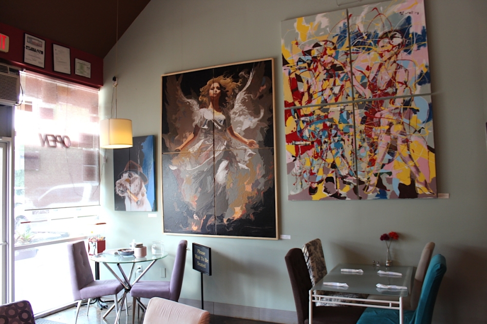 The paintings on Milano Cafe's walls were done by the owner, Sami Demi. (Sarah Hernandez/Community Impact)